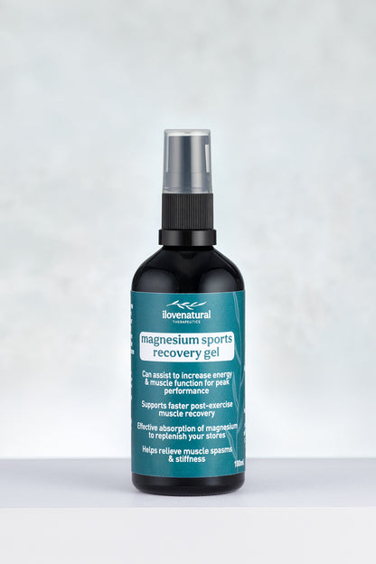 Bottle of lovenatural magnesium sports recovery gel on alight grey dappled background
